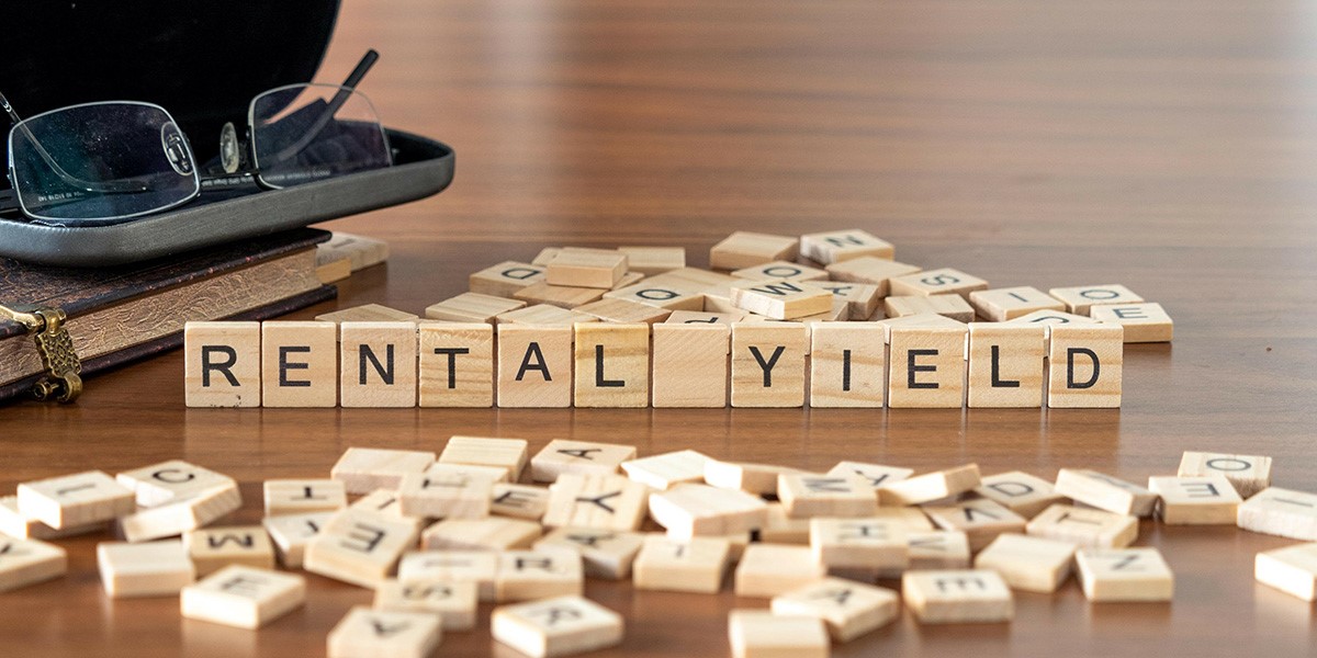 Scrabble letters forming the words rental yield